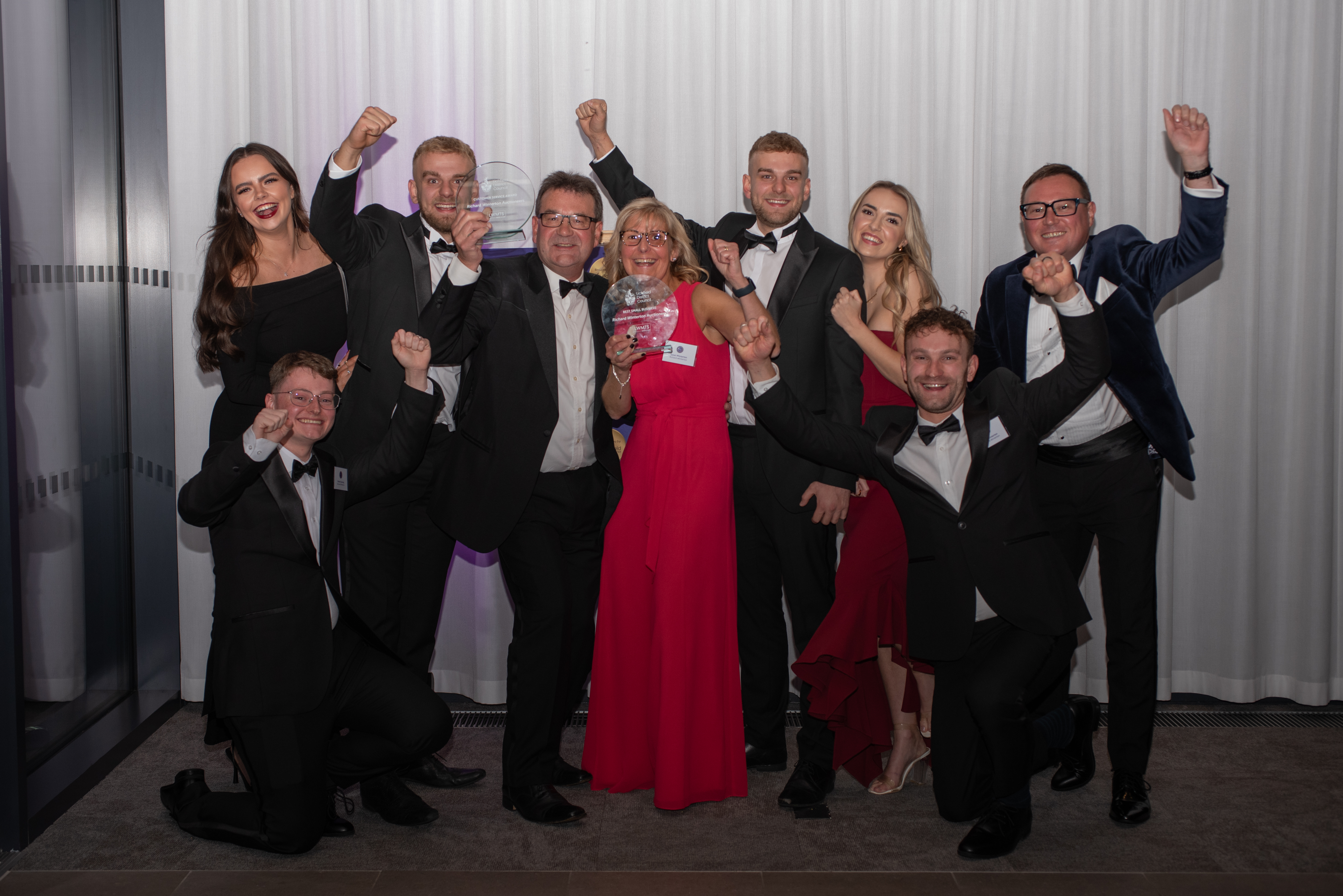 A picture of staff from Richard Winterton Auctioneers celebrating at the Beacon Awards.