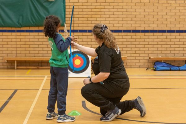 A picture of a young person enjoying a soft archery session.
