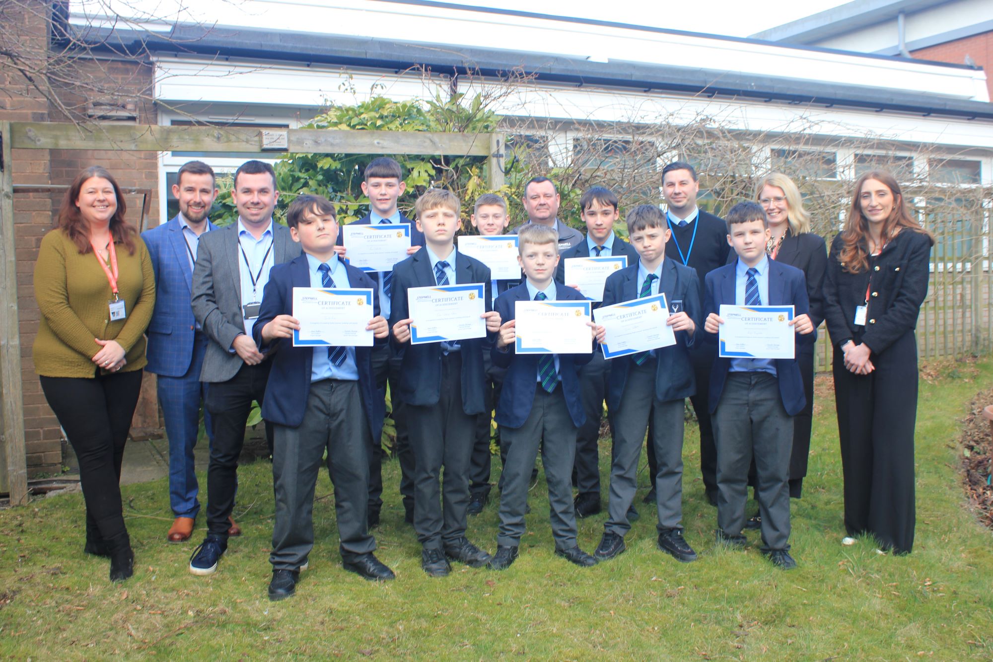 A picture of the students with, from left, Natasha Heritage from Stepnell, Jared Freeman from Lichfield District Council, Councillor Alex Farrell, Matt Birt of Chase Terrace Academy and Beth Sutton and Gemma Stanway of Compliance Chain.