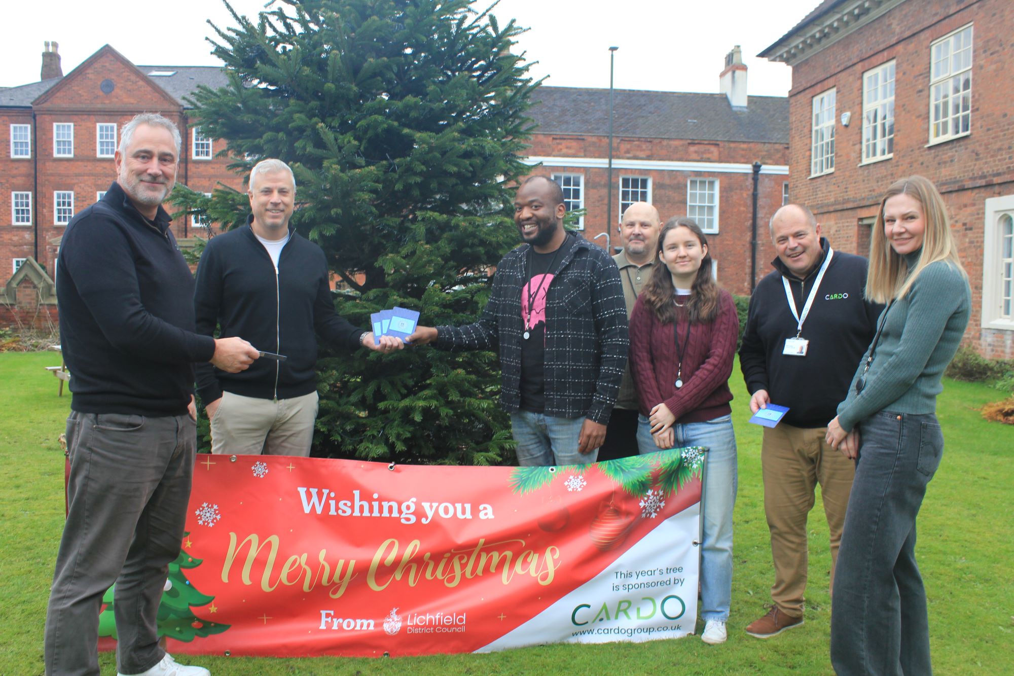 A photo of Cardo Central's presentation of vouchers to Lichfield District Council