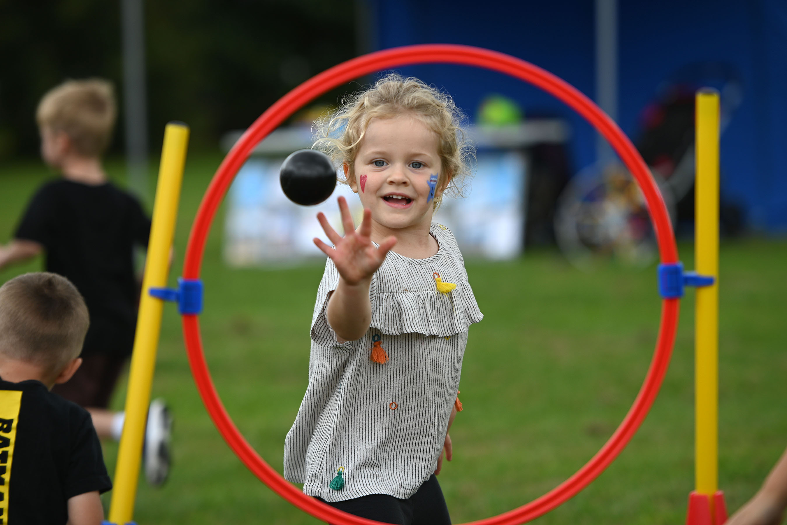 A photo of a youngster enjoying the community games.