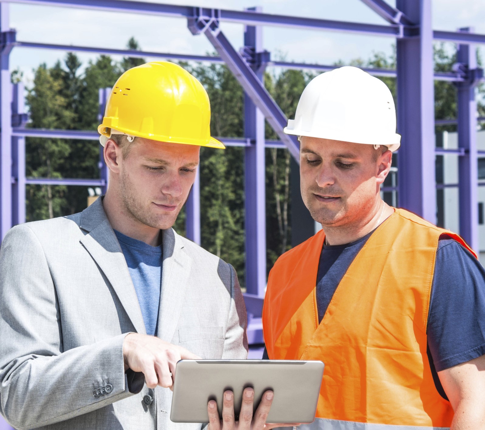 A picture of architects looking over plans.