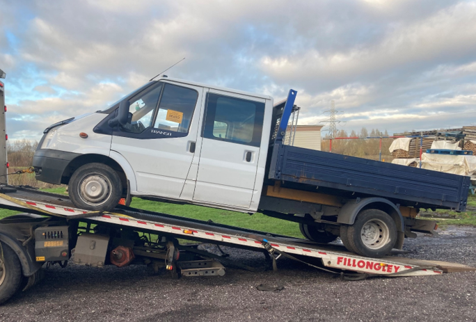 A picture of the seized vehicle being towed away from the fly-tippers&rsquo; workplace.