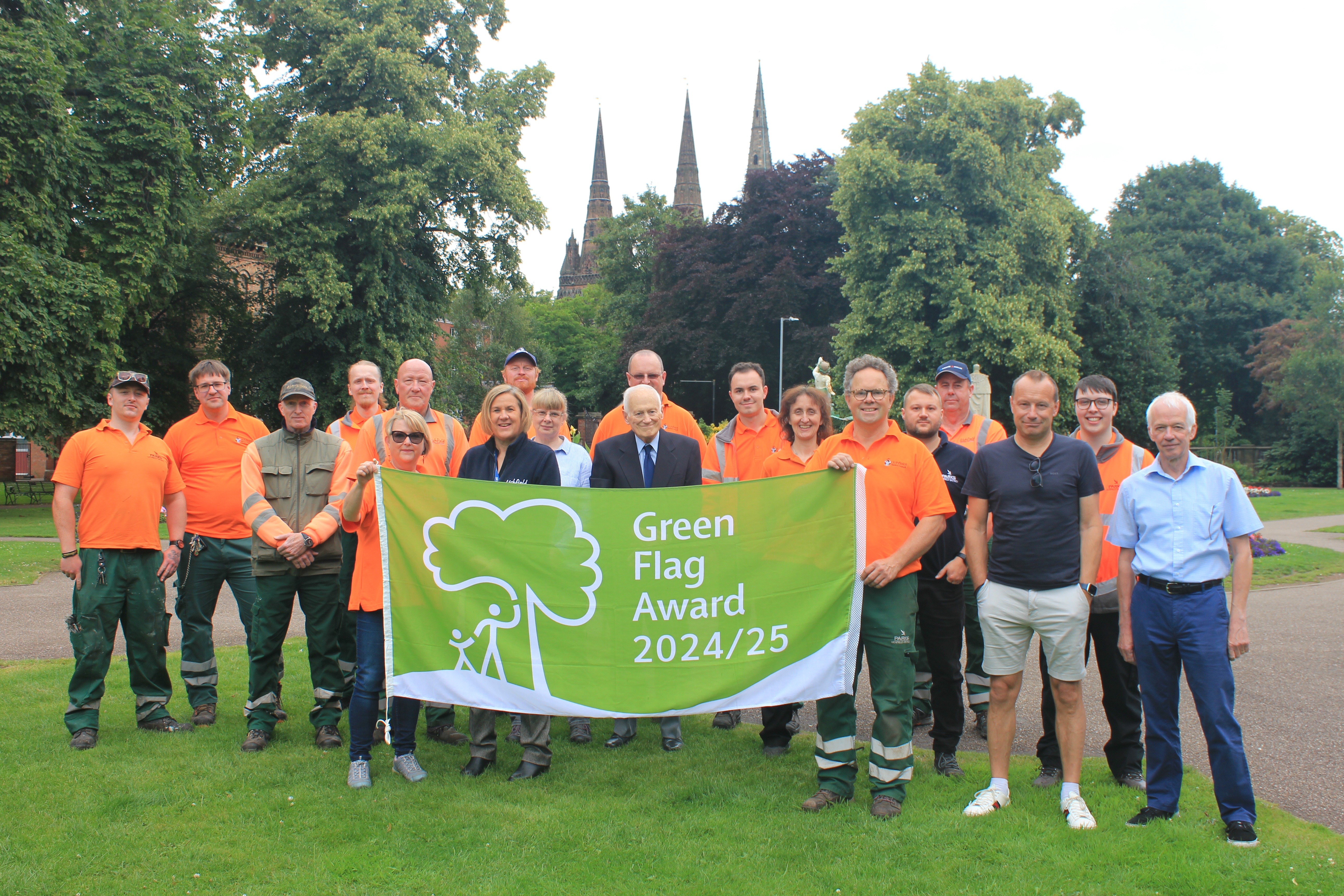 A picture of Lichfield District Council staff, partner representatives and Deputy Leader and Cabinet Member for Leisure and Major Projects Councillor Andy Smith celebrating the Green Flag Award.