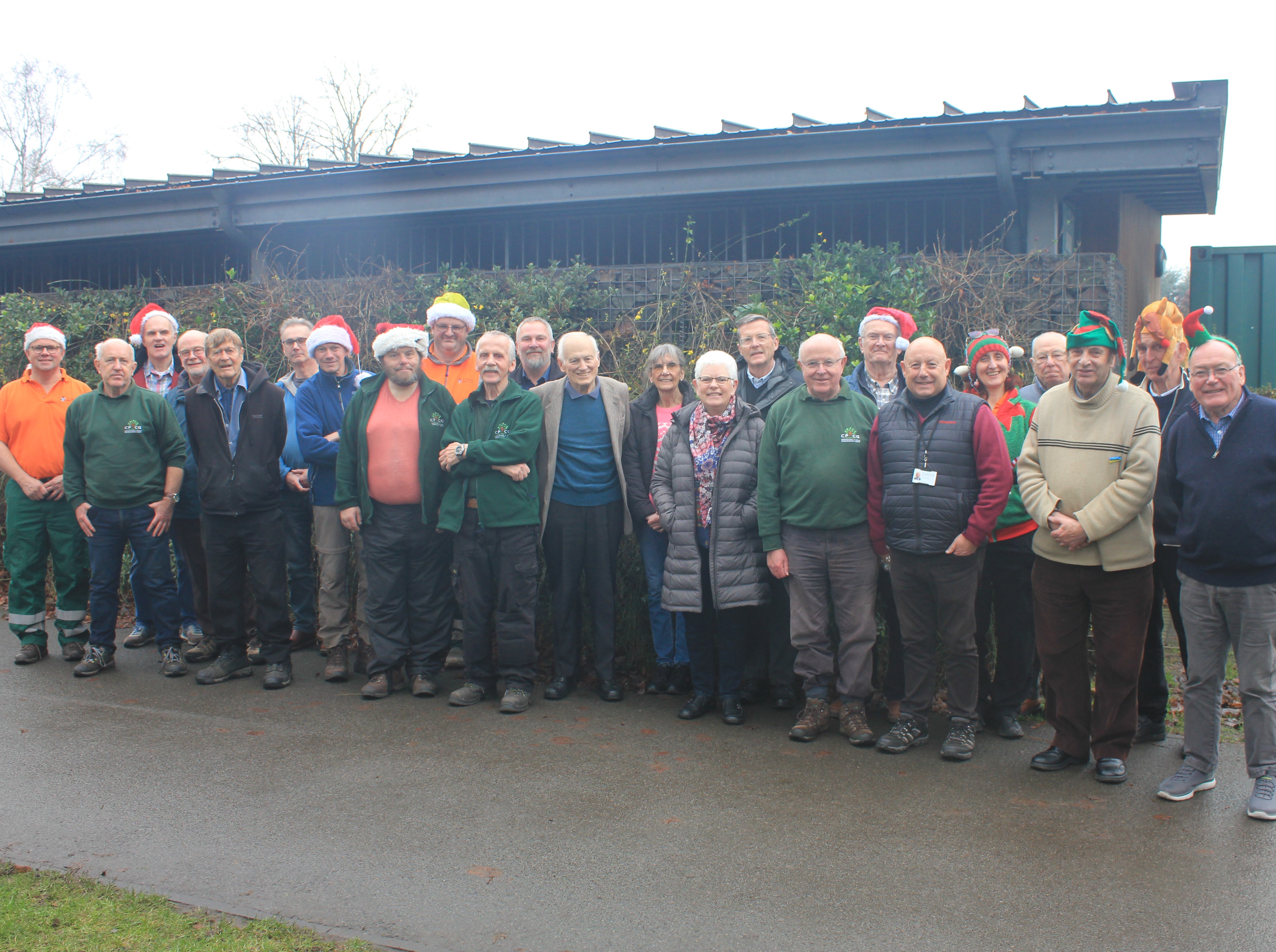 A picture of Lichfield District Parks volunteers gathered at the Discovery Hub in Beacon Park.