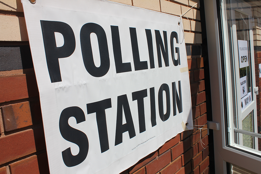 A picture of a polling station sign.