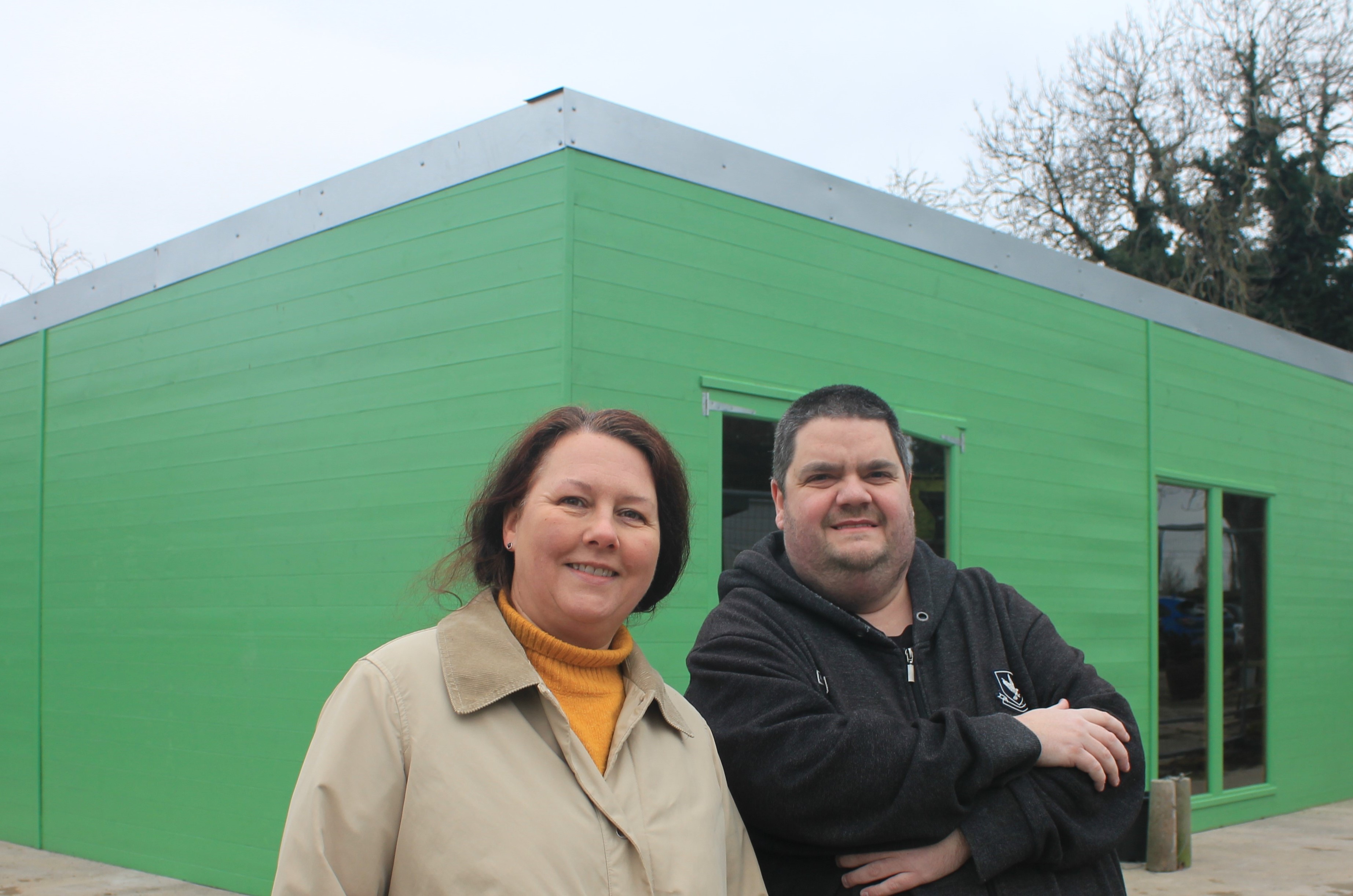 A picture of Richard Cummins of Westwoods Bespoke Dining and Councillor Janice Silvester-Hall, Lichfield District Council’s Cabinet Member for Visitor Economy, Ecology and Climate Change with the building that is being developed into a restaurant.