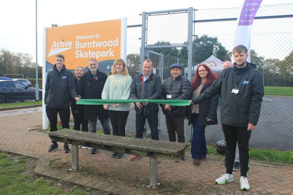 A picture of Councillor Andy Smith Lichfield District Council’s Deputy Leader and Cabinet Member for Leisure and Major Projects and Cllr Laura Ennis, Chair of Burntwood Town Council jointly cutting the ribbon to officially open Burntwood Skatepark.