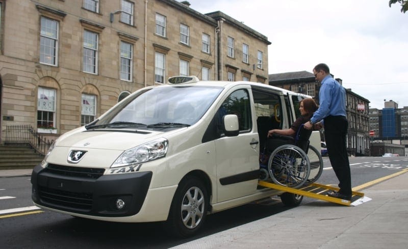 Picture of a wheelchair user accessing a vehicle